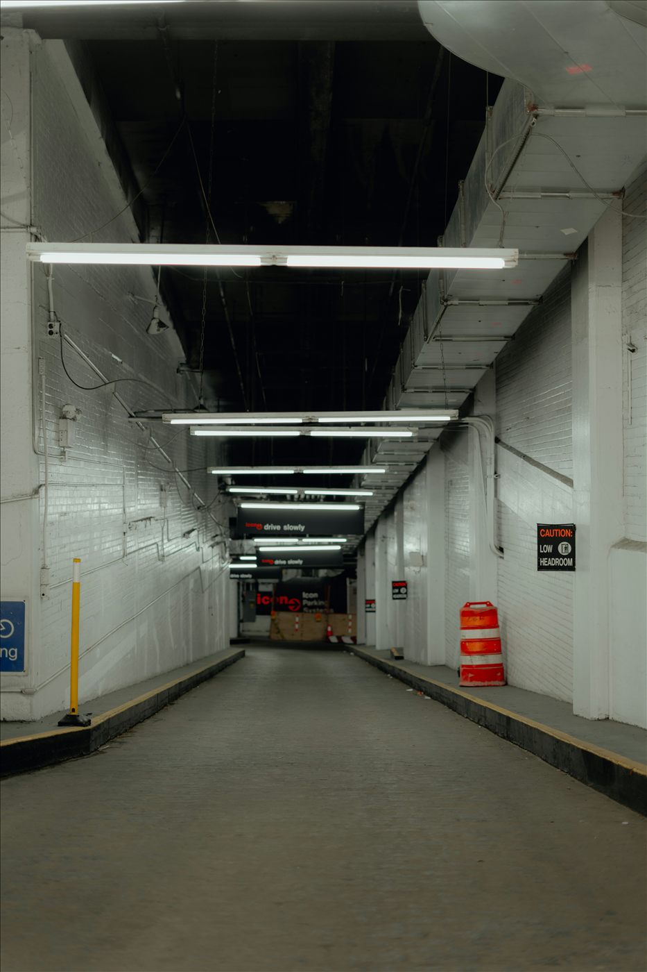 Interior utility tunnel with overhead lighting