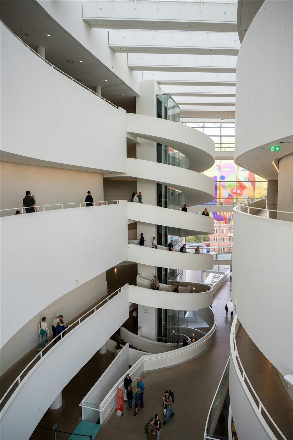 Modern museum gallery interior with visitors